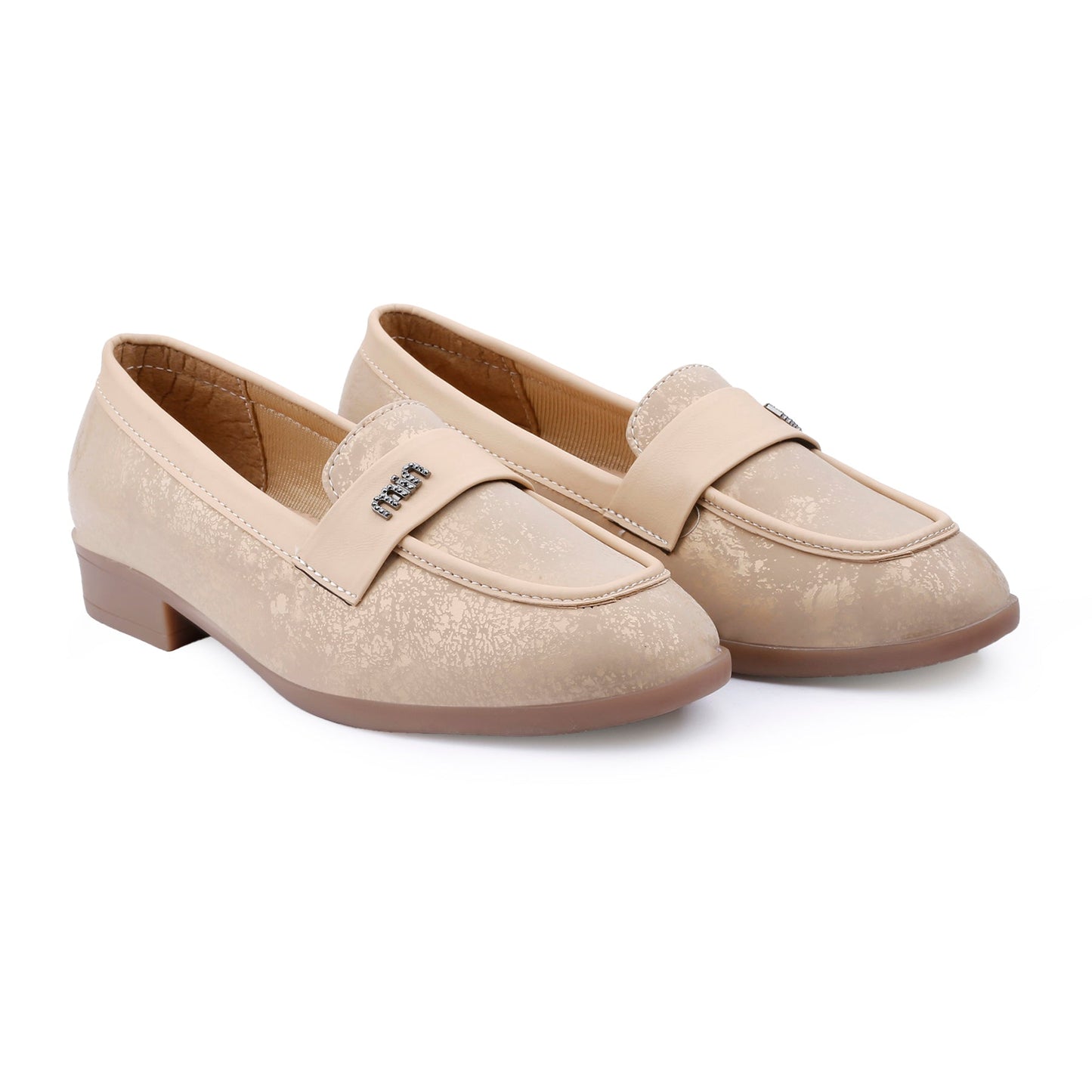 A pair of women's beige slip-on loafers with a subtle textured pattern, low block heels, and a decorative strap across the instep, shown on a plain white background.