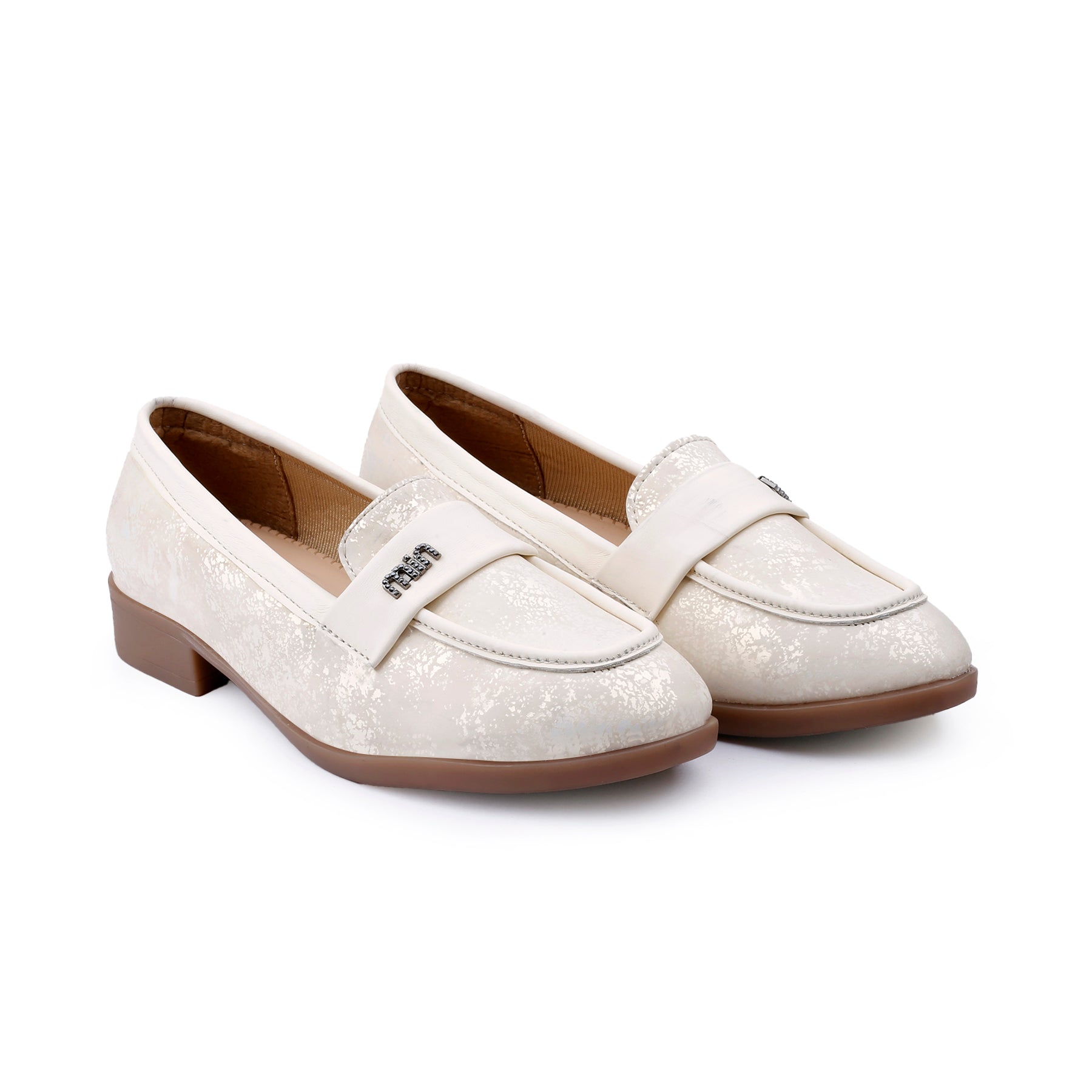 A pair of women's penny loafers in a textured cream/off-white finish with a brown low block heel and sole, shown on a plain white background.