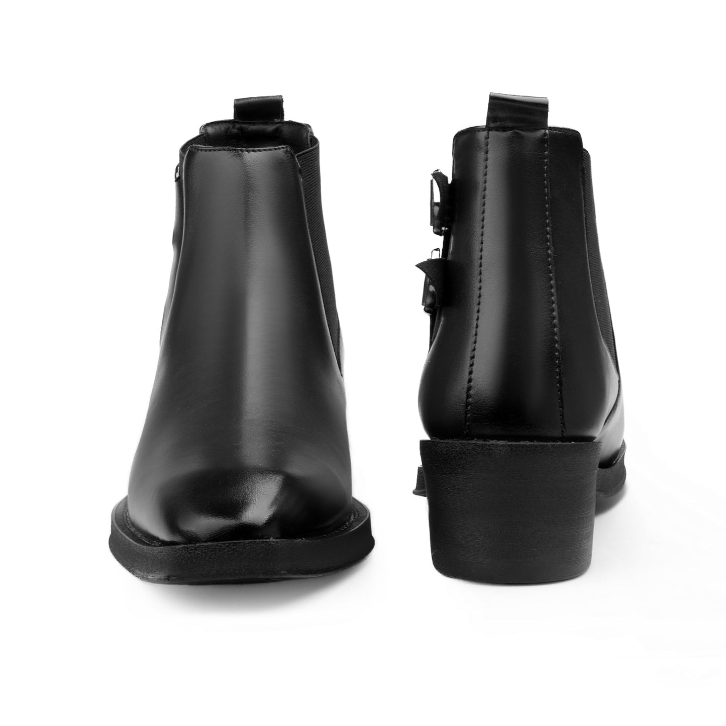 Black leather boots with buckle details on a white background