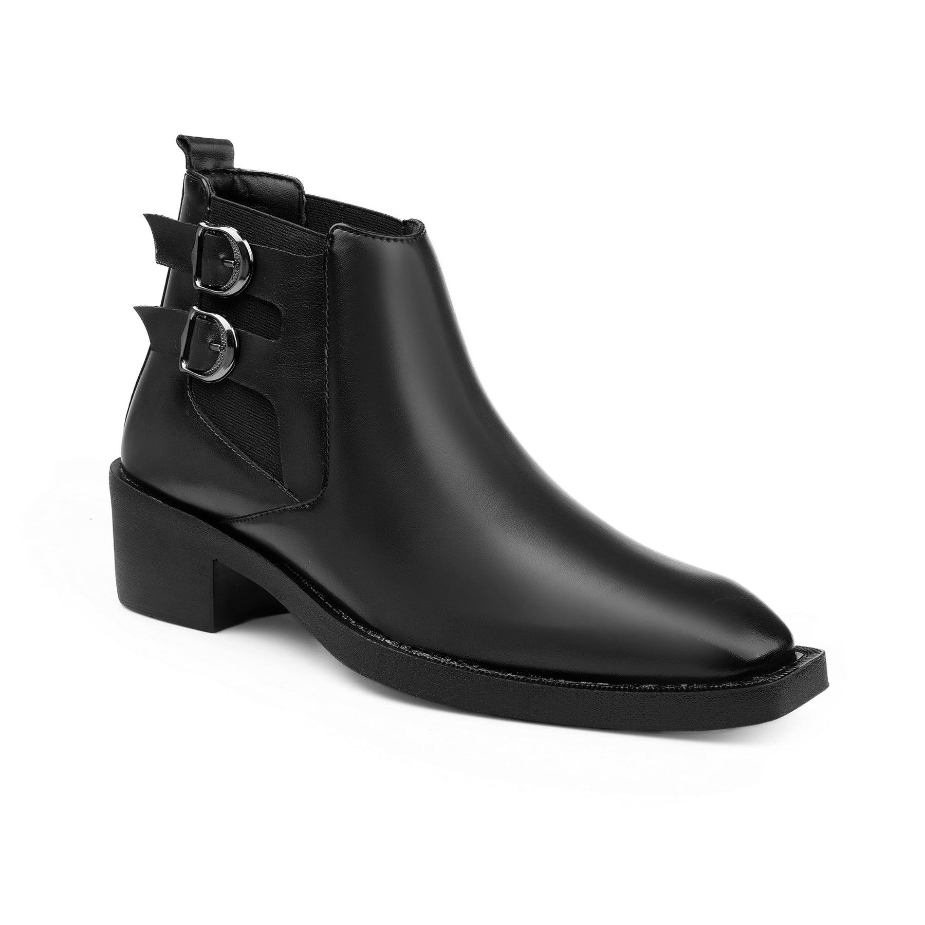 Black ankle boot with buckles on a white background