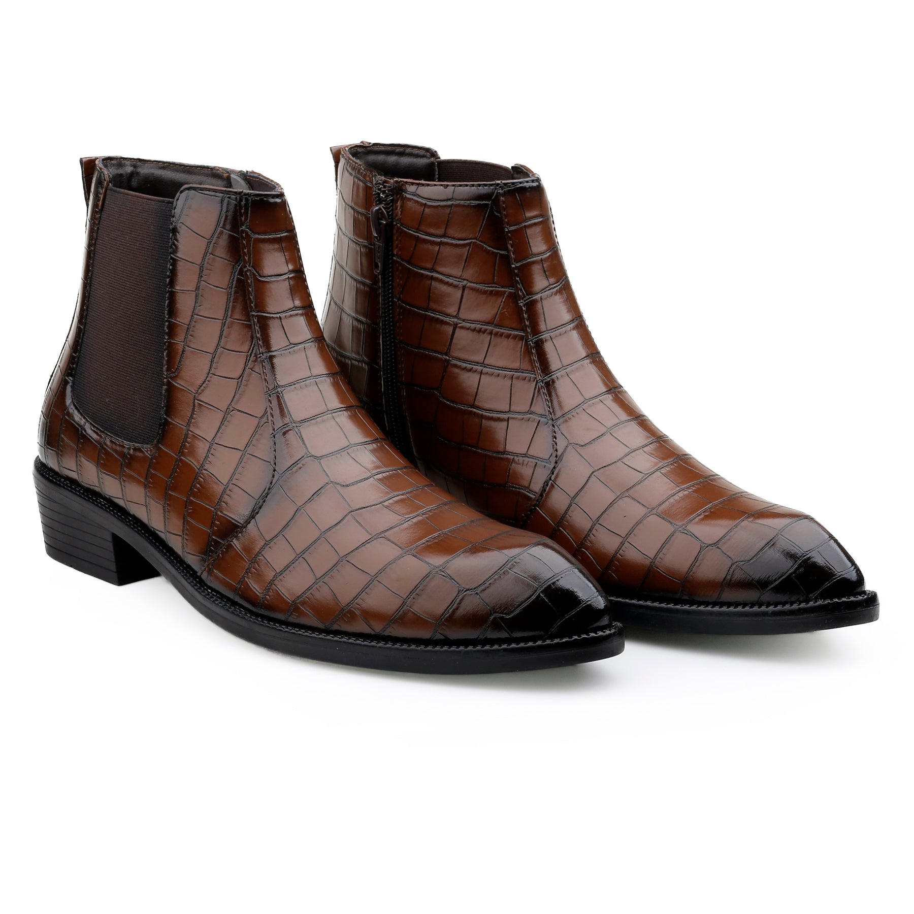 Pair of brown crocodile-patterned leather boots on a white background