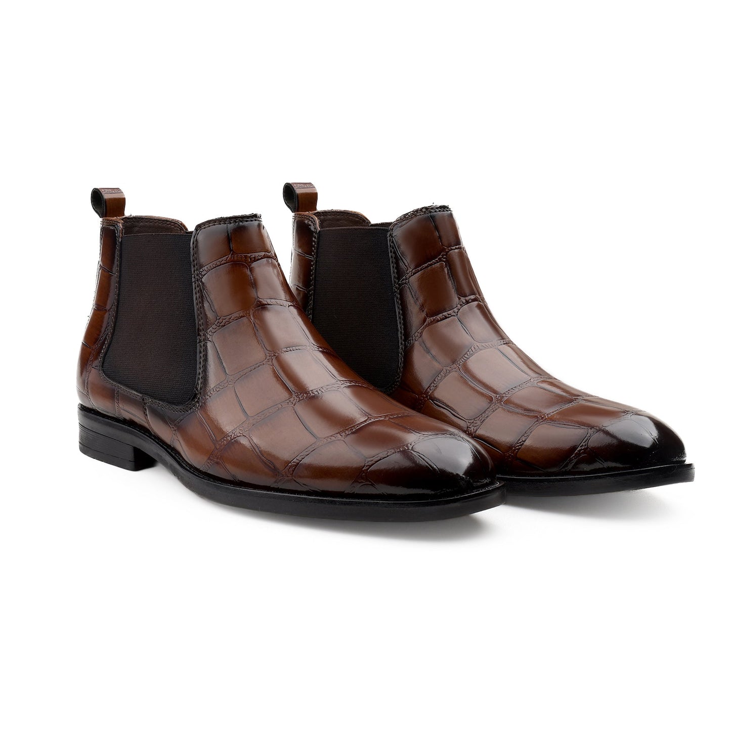 Pair of brown crocodile-patterned leather boots on a white background