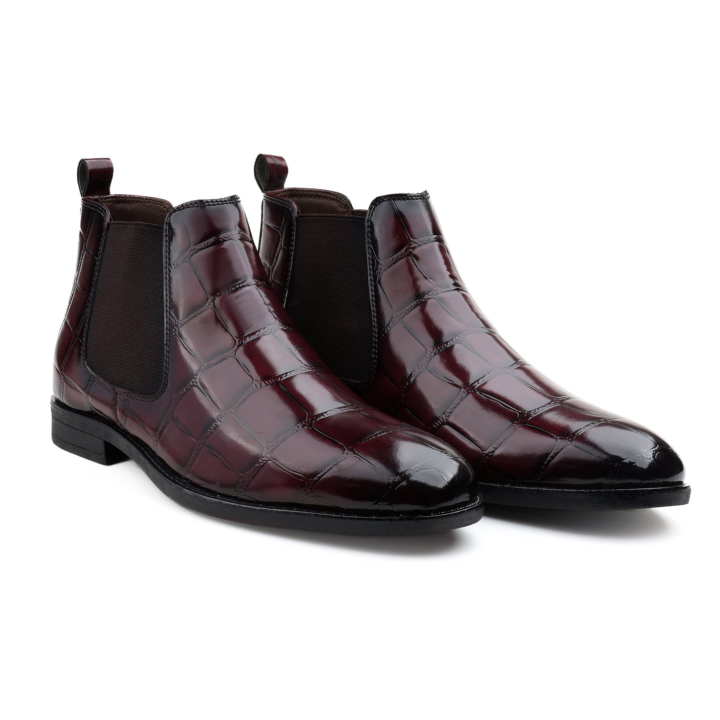 A pair of men's Chelsea boots in glossy dark burgundy crocodile-embossed leather with black elastic side panels, shown on a clean white background.