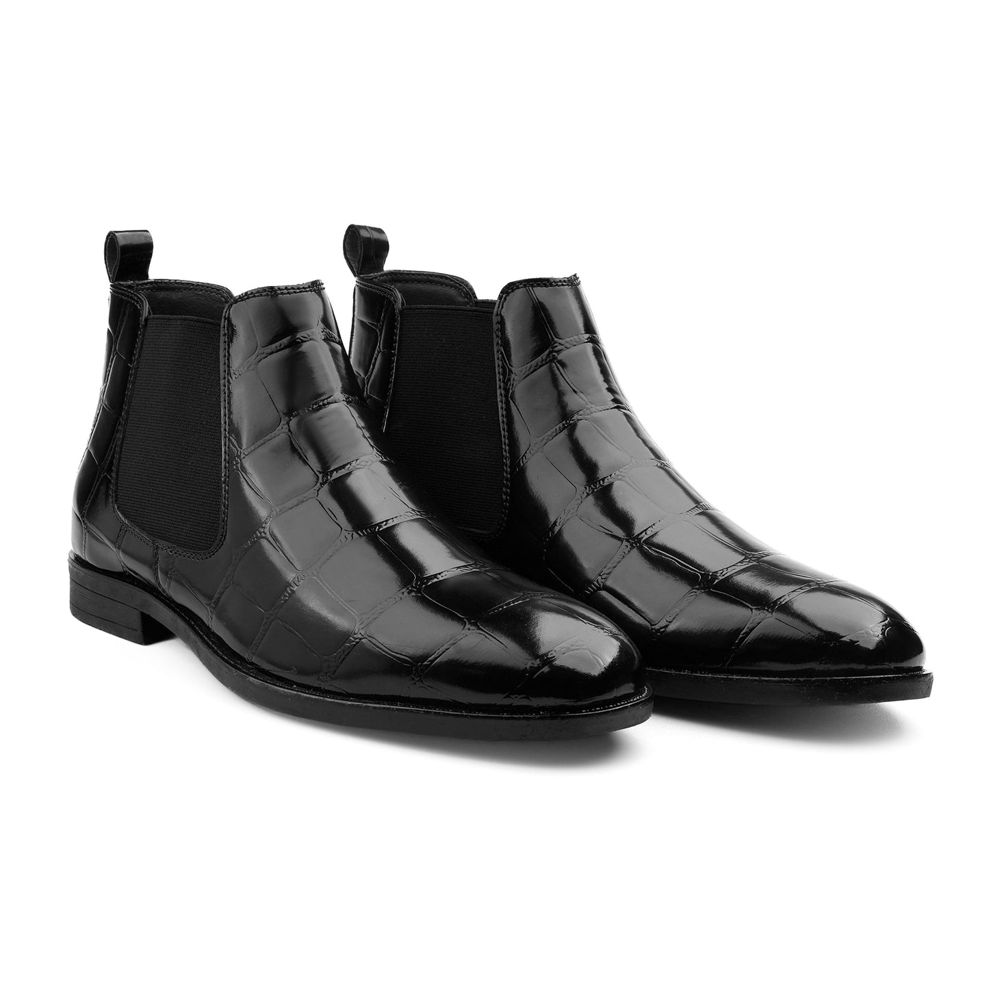 Black crocodile-patterned Chelsea boots on a white background
