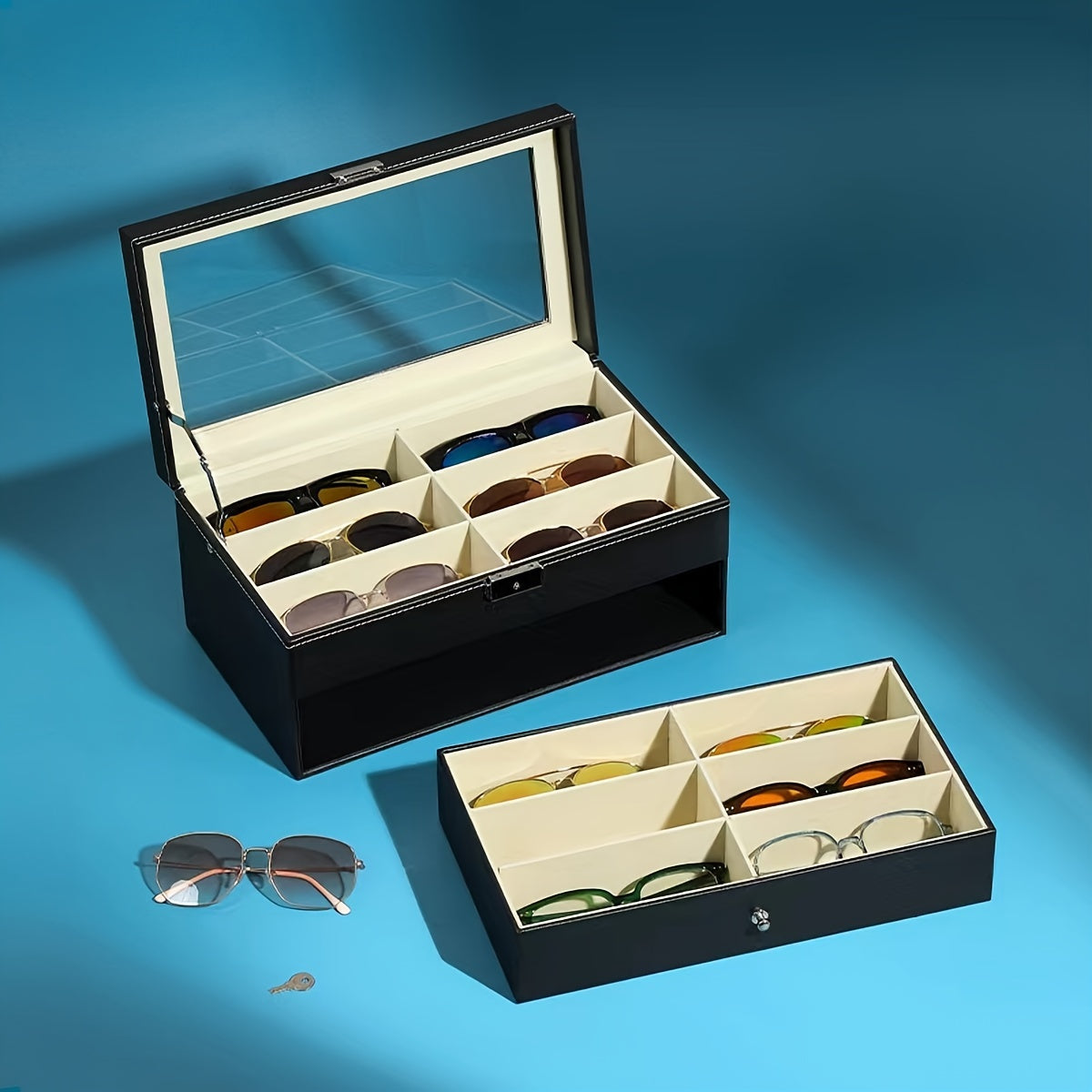 Black eyeglass case with multiple compartments on a blue background