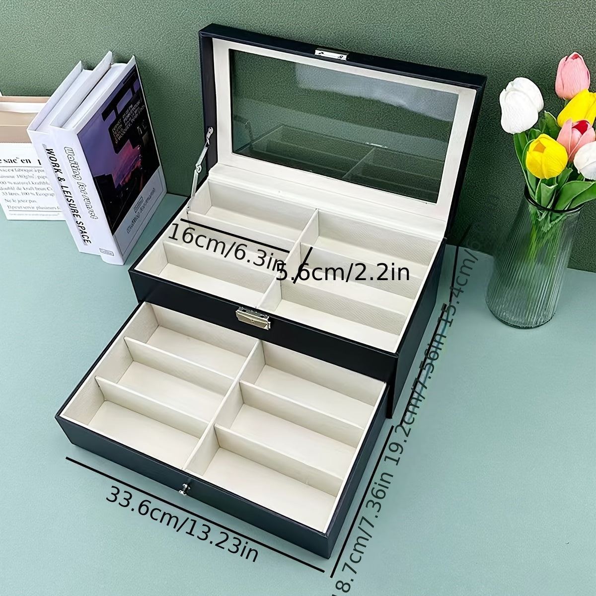 Jewelry box with dimensions labeled on a light blue surface with a green wall background.