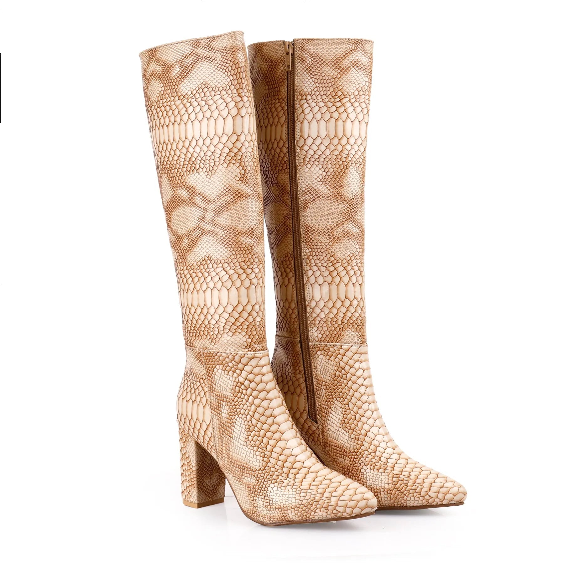 A pair of knee-high pointed-toe boots with a tan and beige python-style snakeskin pattern, featuring a high block heel and a side zipper.