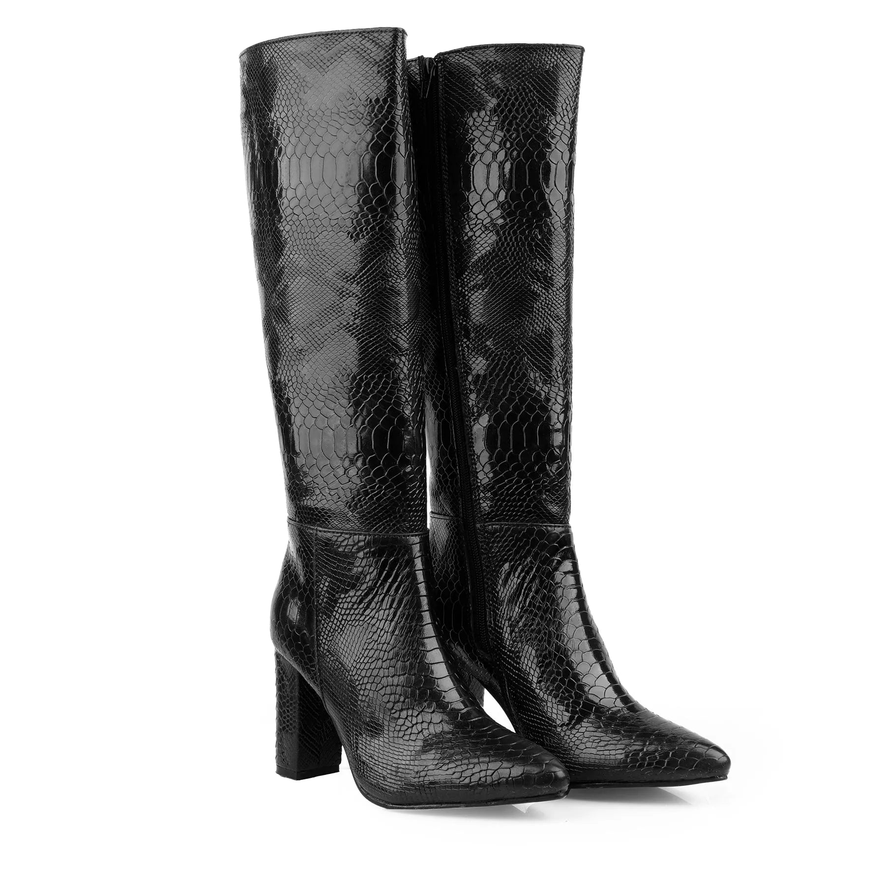 A pair of black knee-high boots with a glossy snakeskin texture, featuring a pointed toe and a chunky block heel, set against a plain white background.