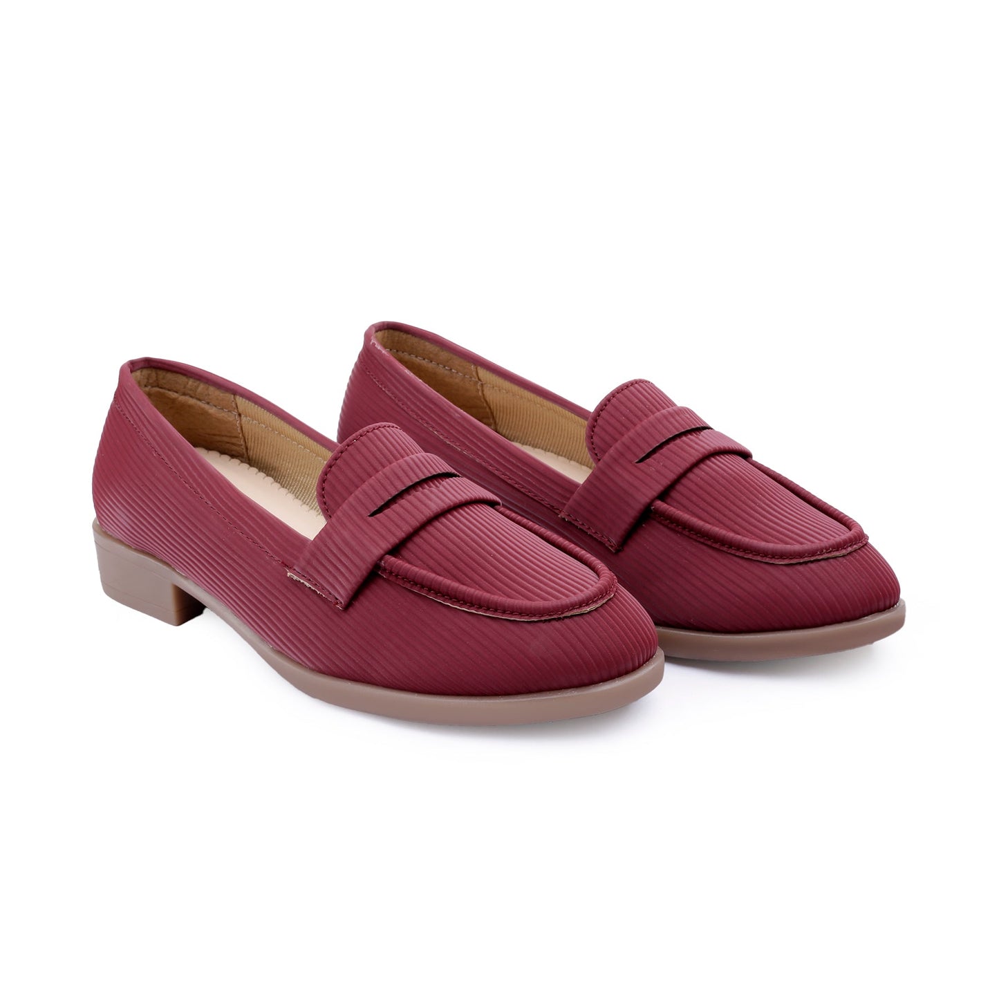 A pair of women's penny loafers in a textured burgundy red material, featuring a low block heel and a light tan interior, shown on a plain white background.