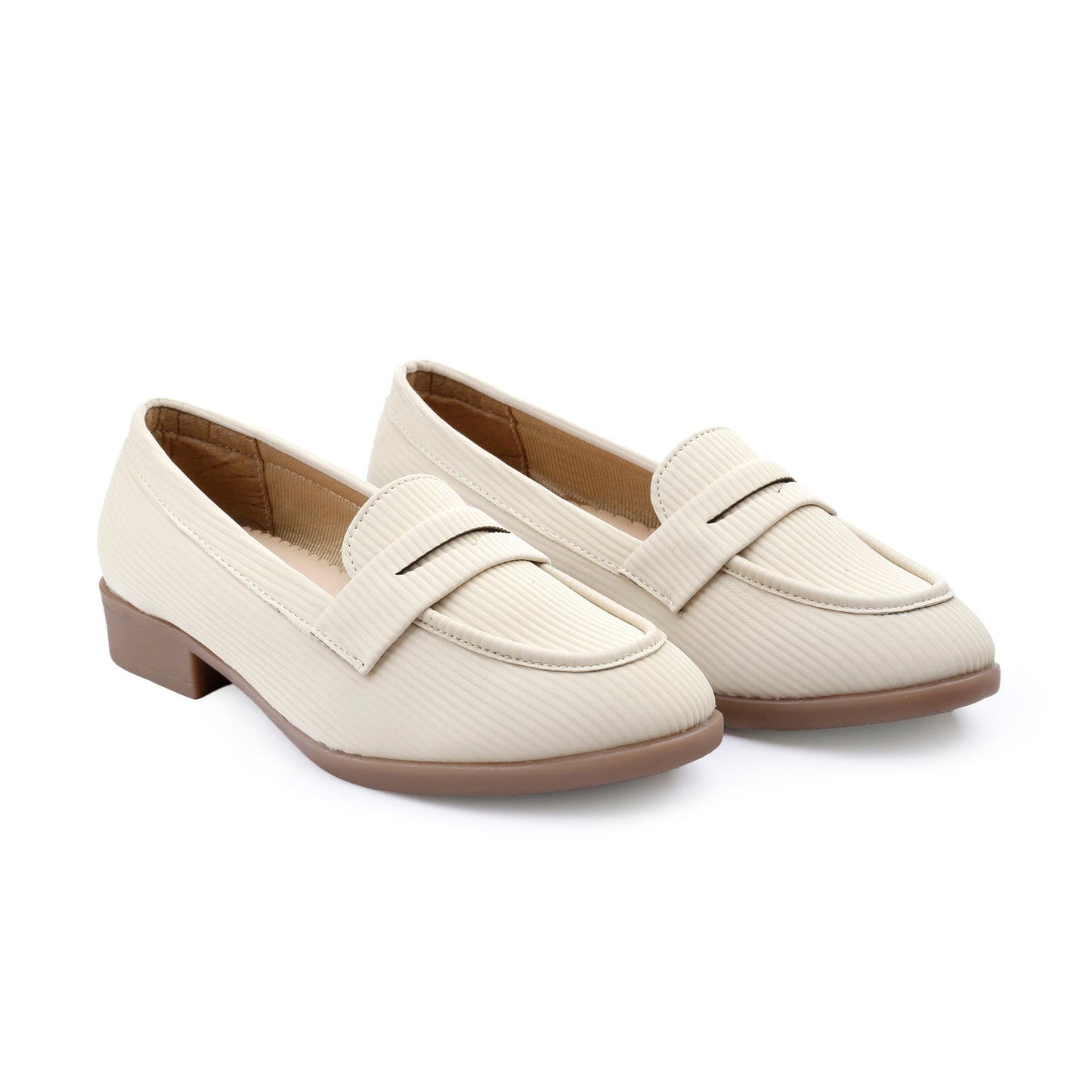 Pair of cream loafers on a white background