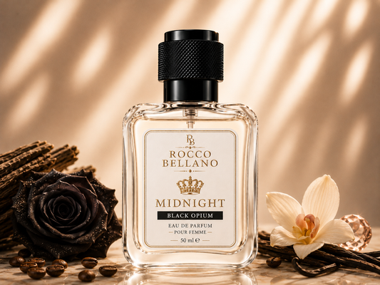 Rocco Bellano Midnight Black Opium perfume bottle with flowers and coffee beans on a warm background