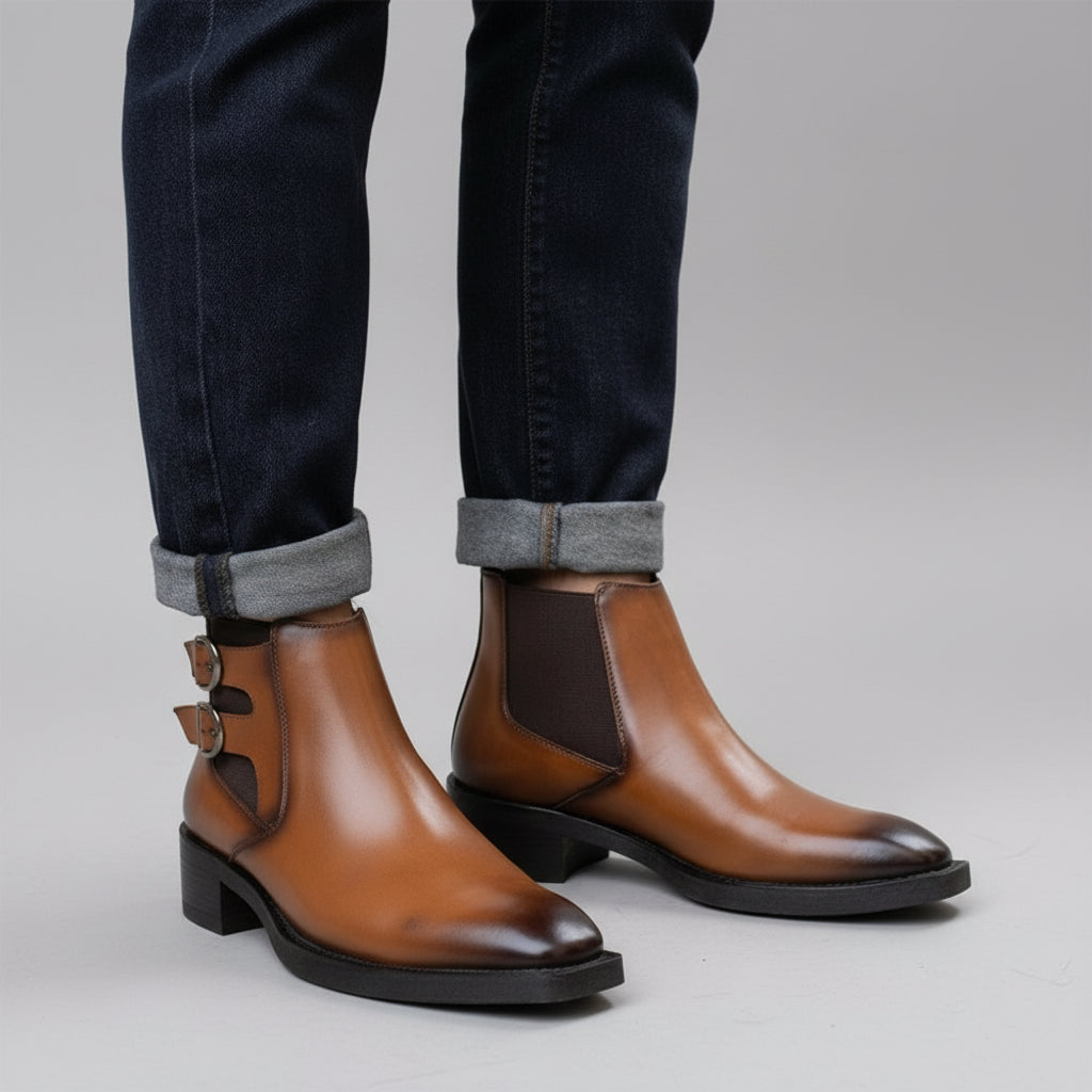 Brown leather boots worn on a stone pavement