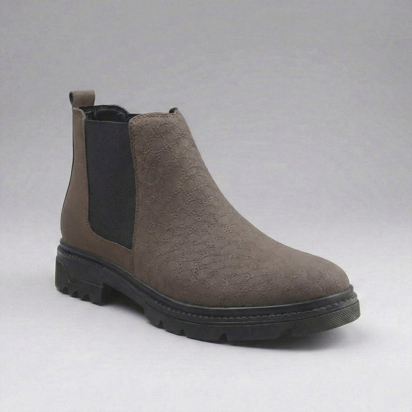 Gray Chelsea boot on a light gray background