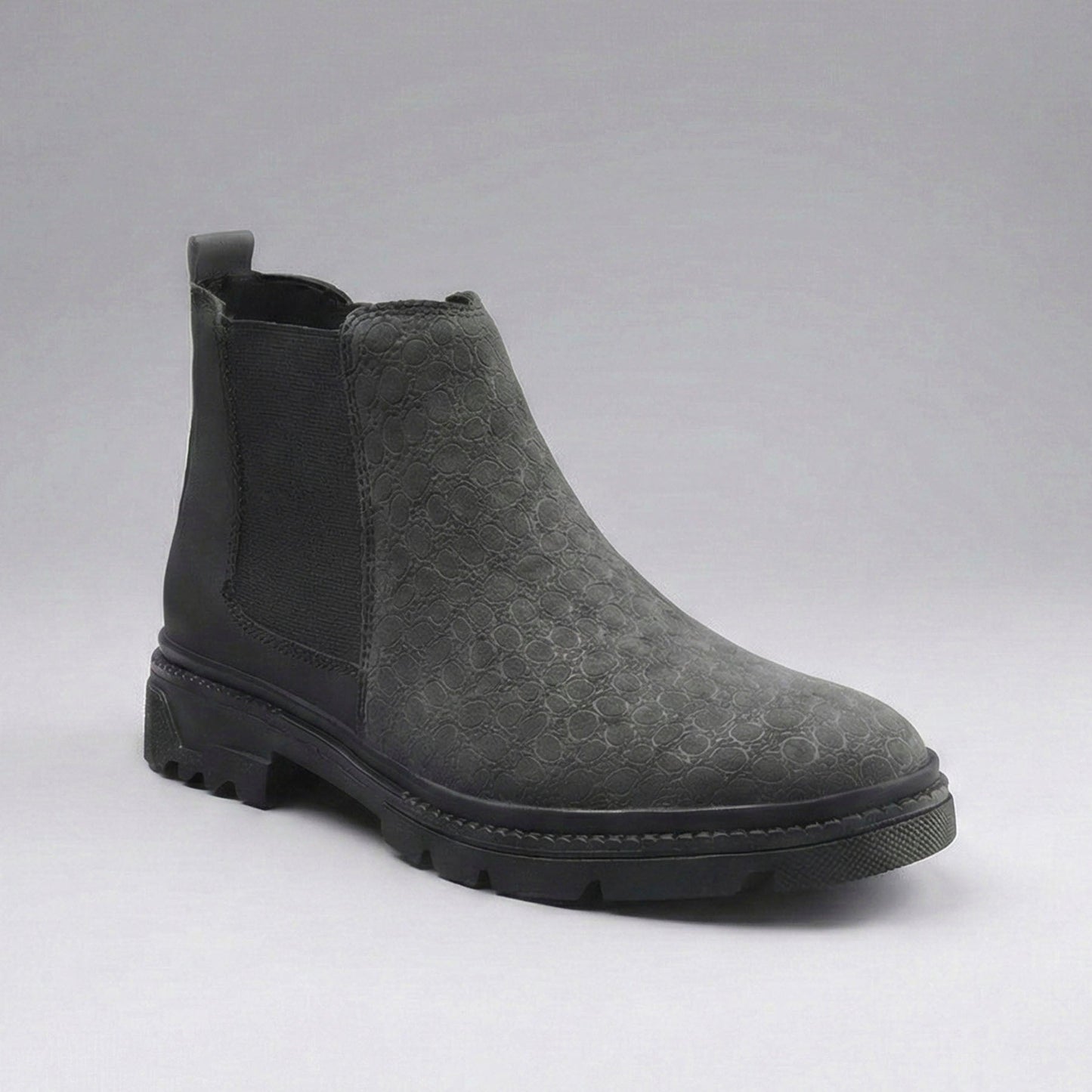 Gray Chelsea boot on a gray background