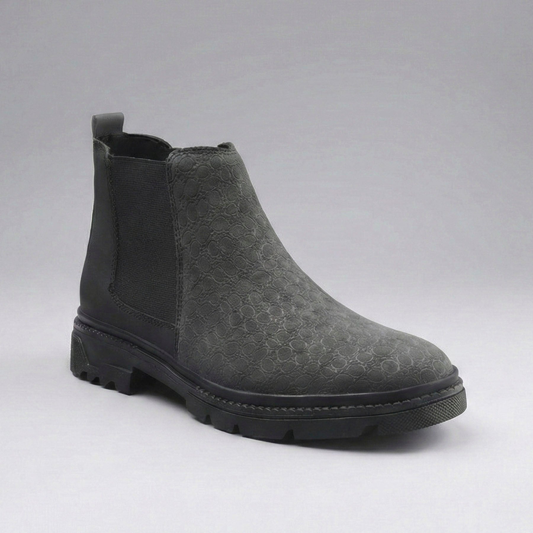 Gray Chelsea boot on a gray background