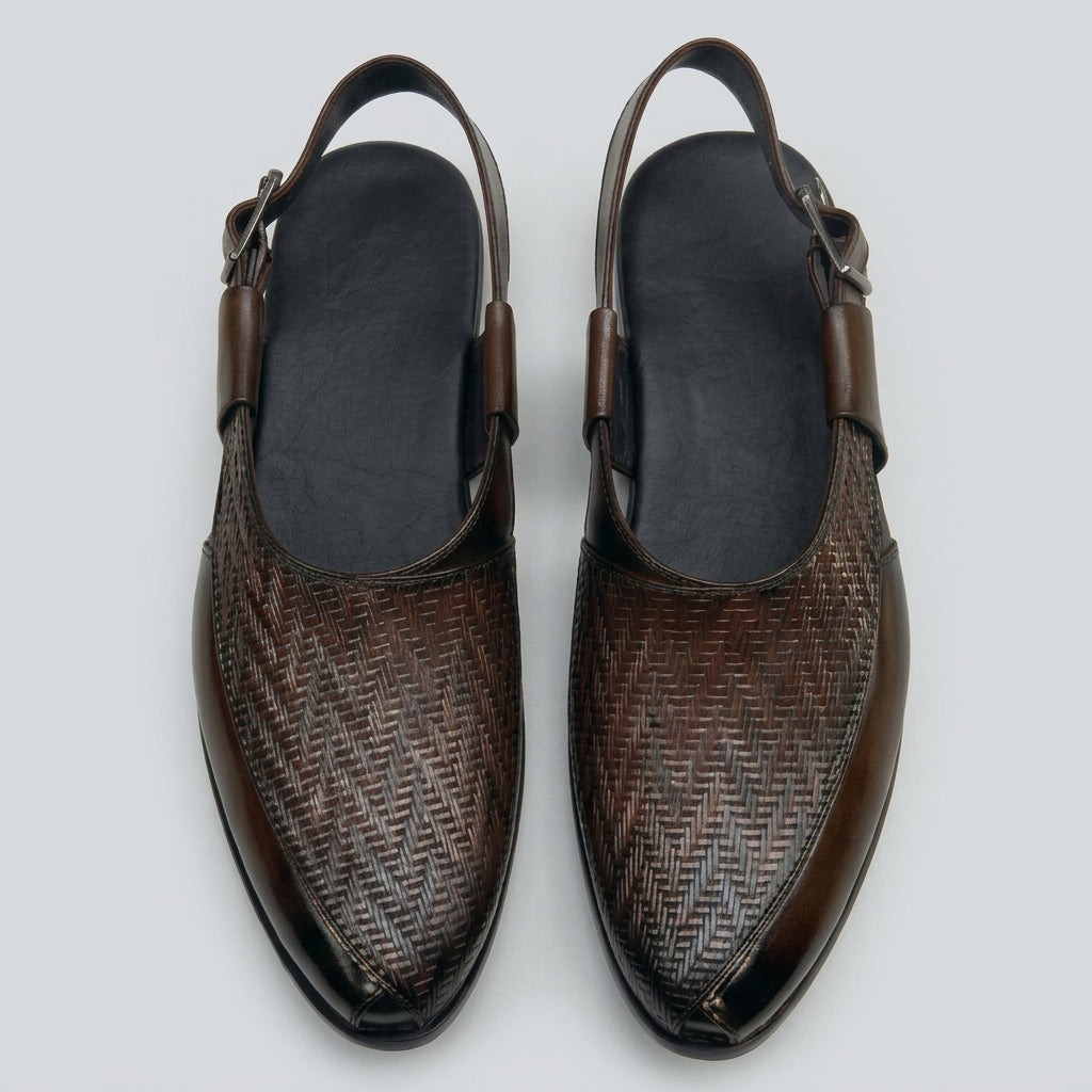 A pair of dark brown leather slingback shoes with a textured woven pattern on the toe, shown from a top-down view on a light gray background.