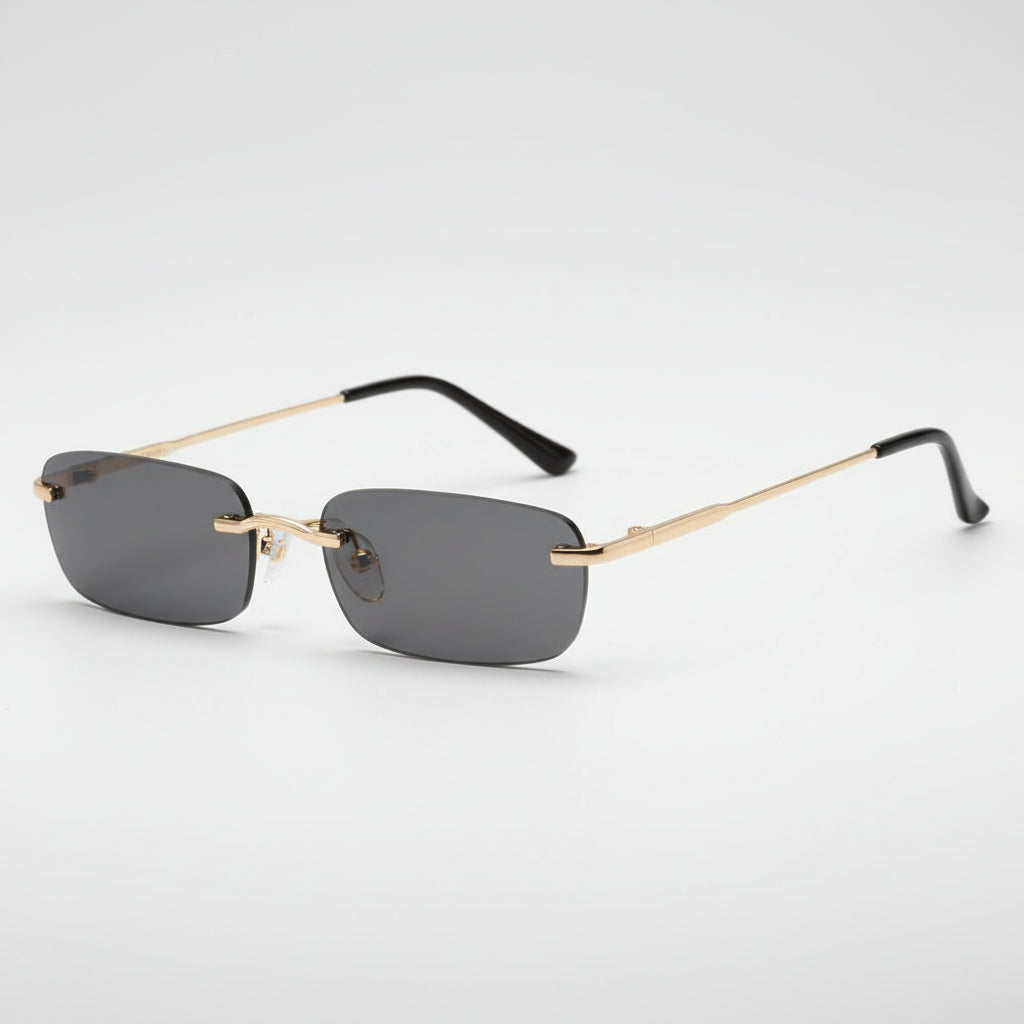 Rimless square sunglasses with dark gray lenses and gold metal frames, shown on a plain white background.