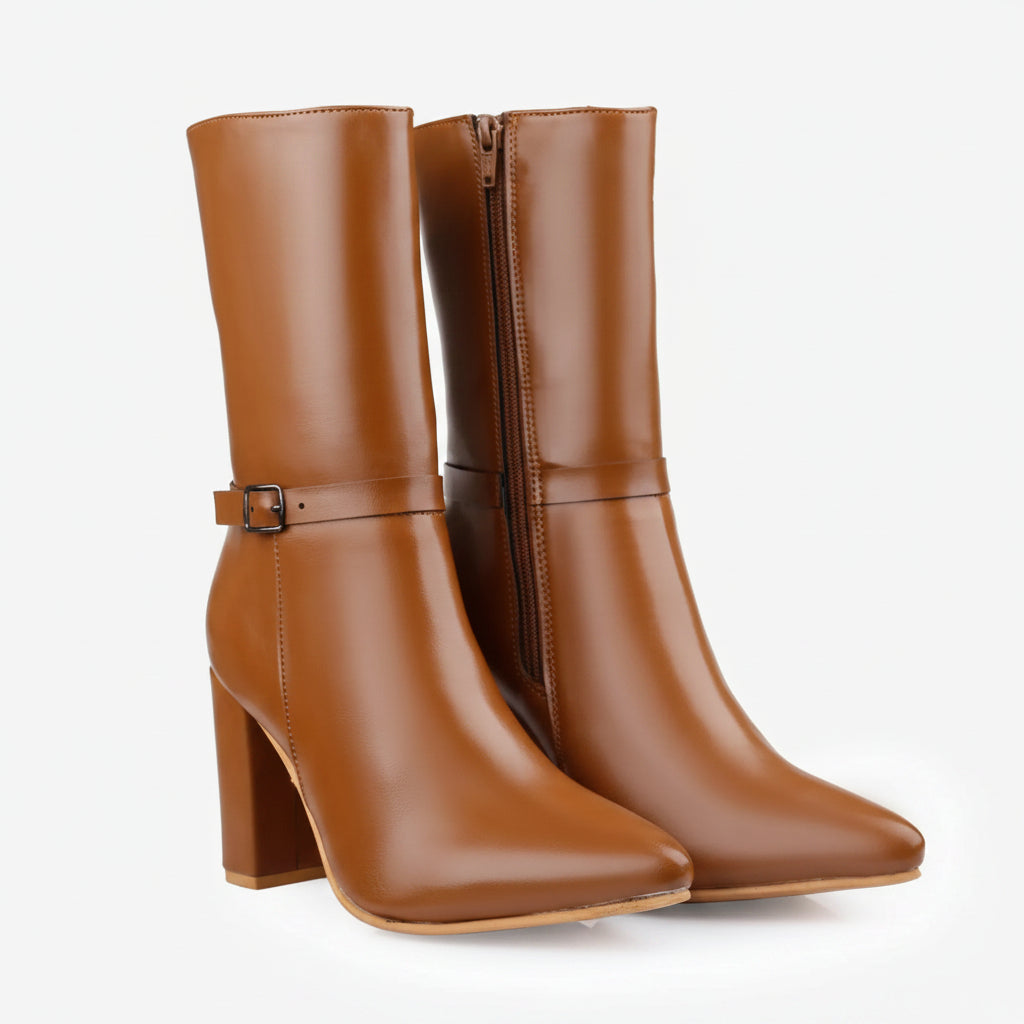 A pair of mid-calf brown leather boots with pointed toes, block heels, and side buckle straps, shown on a clean white background.