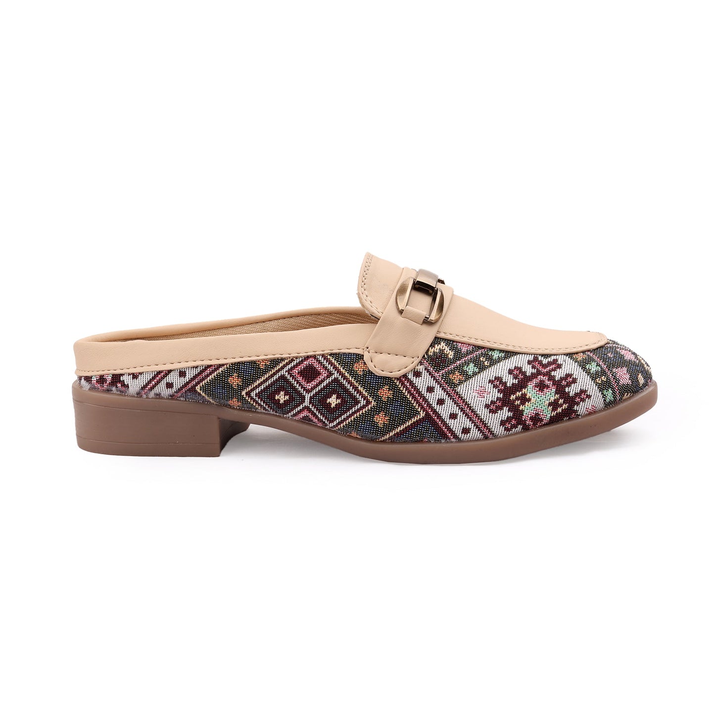 A single women's mule loafer shown in profile on a white background. The shoe features a beige faux-leather strap with a small gold-tone buckle, a beige heel counter, and a patterned textile upper with geometric motifs in red, blue, green, and beige on a dark background.