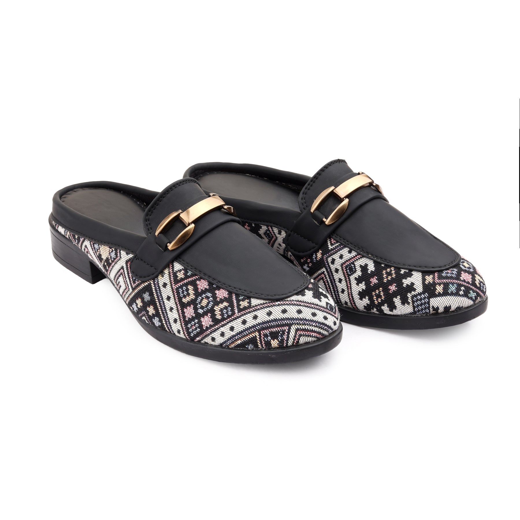 Black loafers with patterned straps and gold buckles on a white background