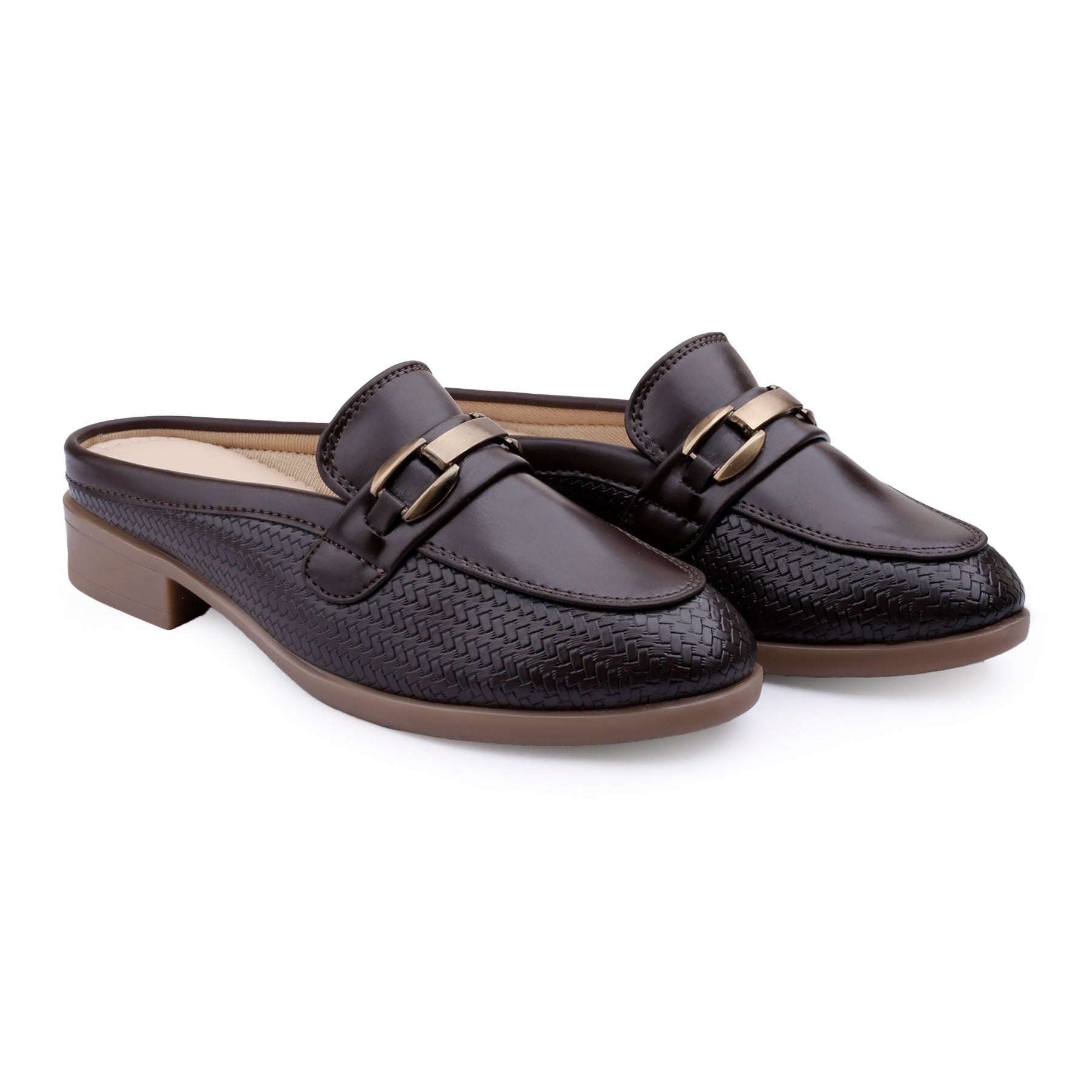 A pair of dark brown leather mule loafers with a textured woven pattern, featuring a low block heel, a strap across the top with a gold-tone buckle, and a brown sole, shown on a white background.