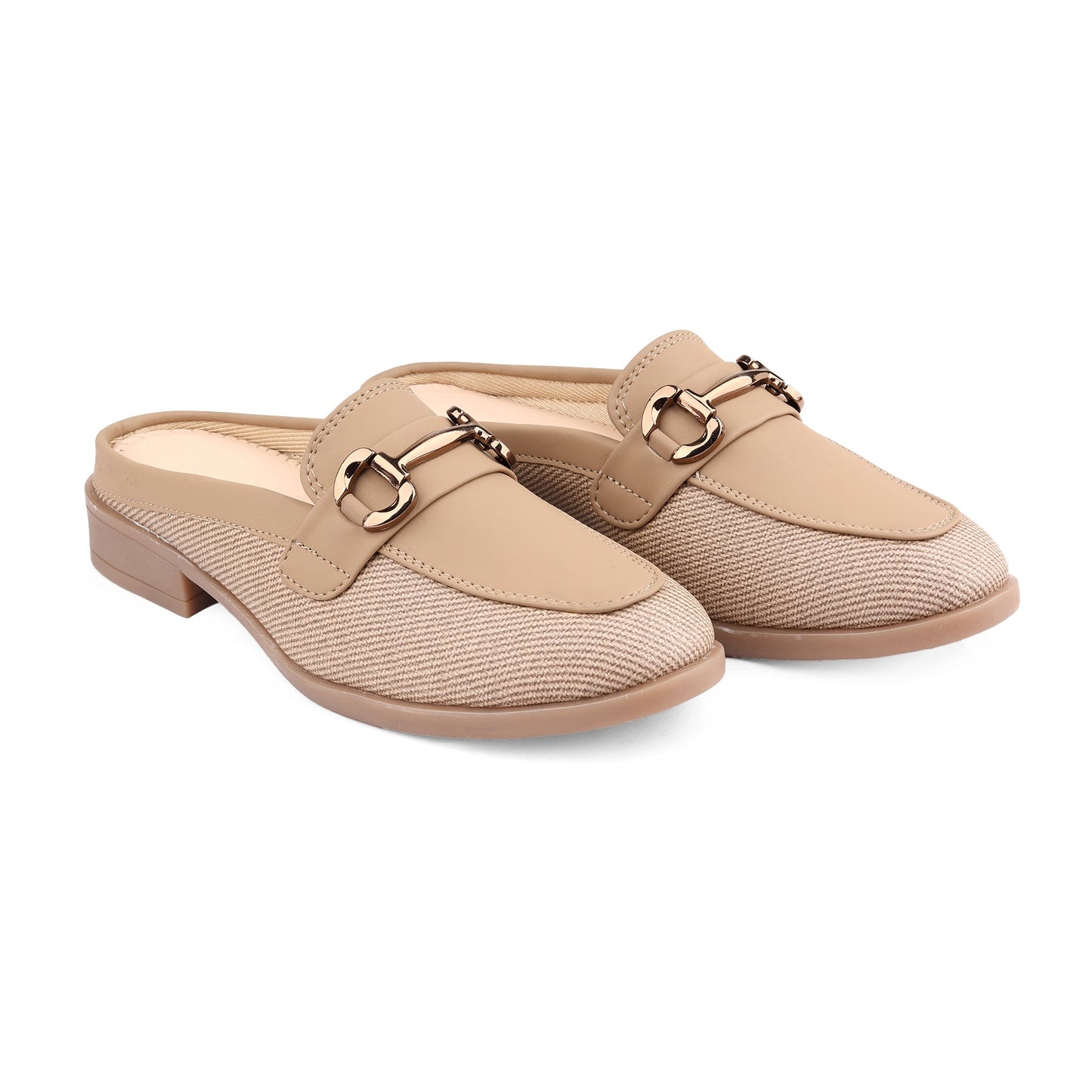 Pair of beige loafers with gold buckles on a white background