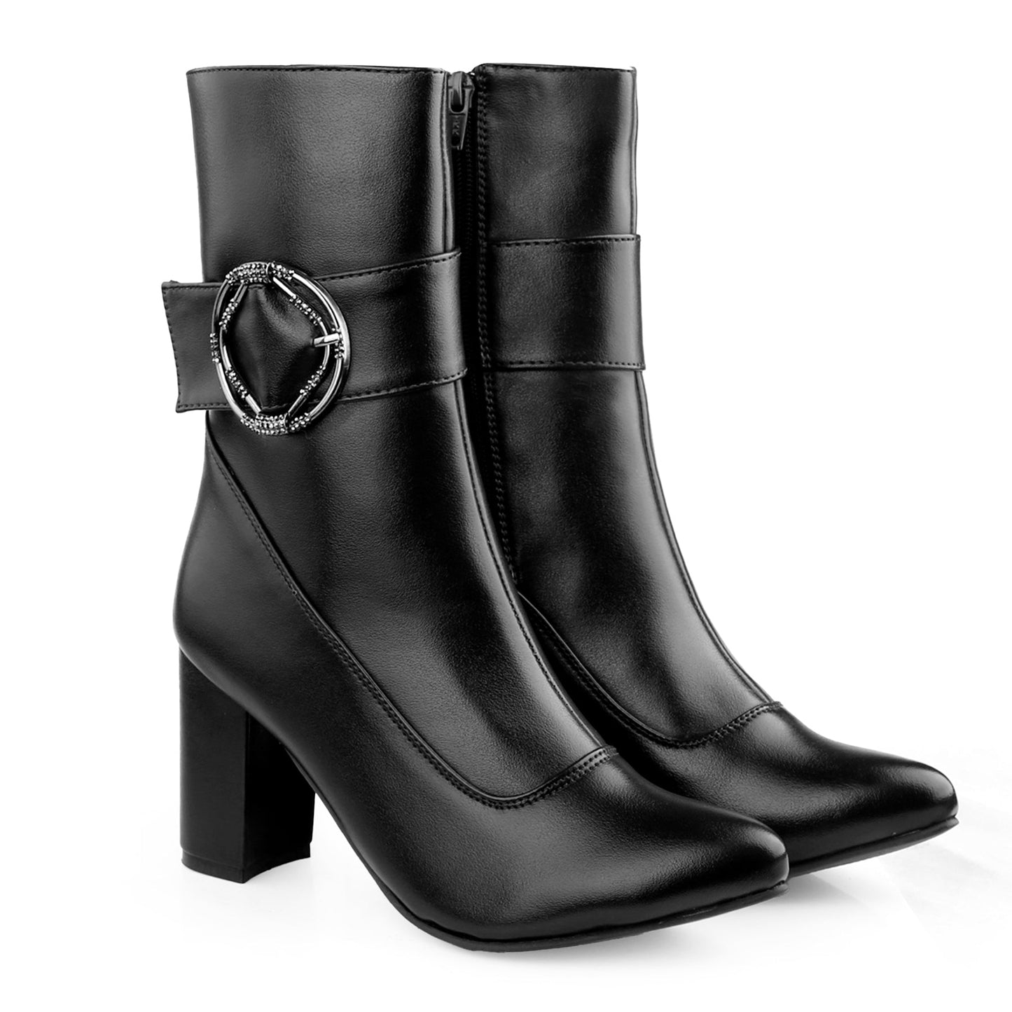 A pair of black faux-leather ankle boots with a block heel, pointed toe, and a decorative silver-tone buckle strap on the outer side, shown against a plain white background.