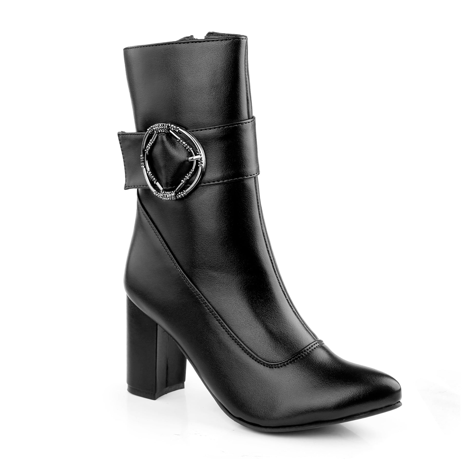 A black faux-leather ankle boot with a block heel, pointed toe, and a decorative strap with a silver-tone circular buckle on the side, shown against a plain white background.