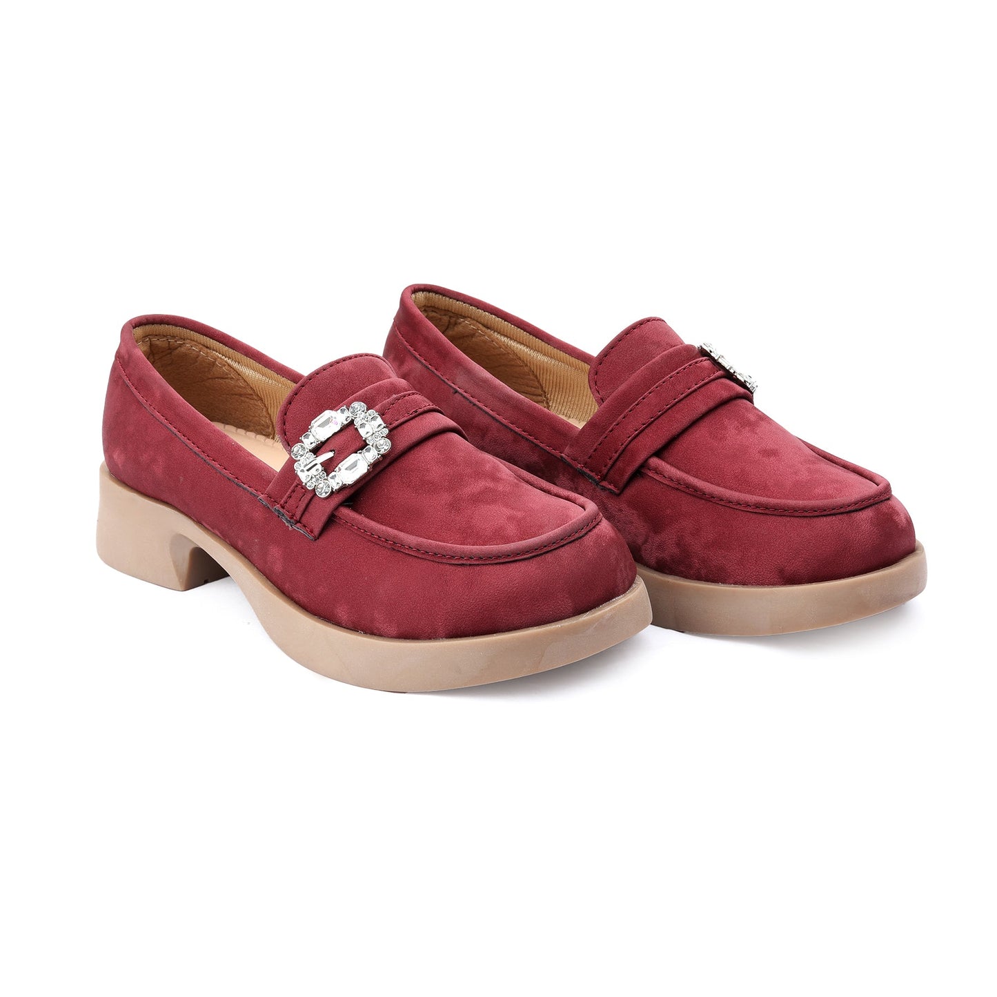 Pair of red loafers with a decorative buckle on a white background